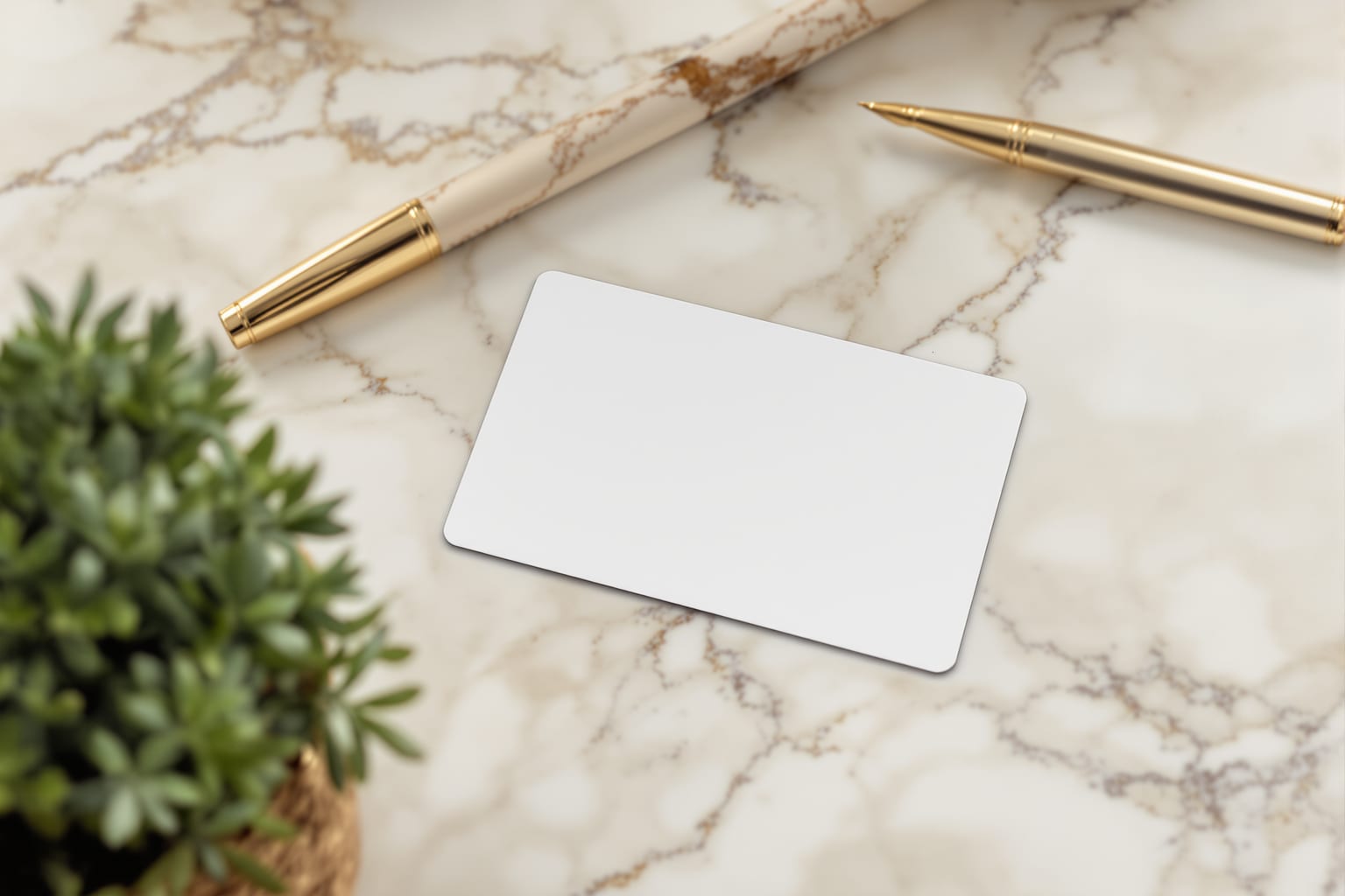 A med spa membership card on a marble counter beside a phone showing a rewards balance in warm light