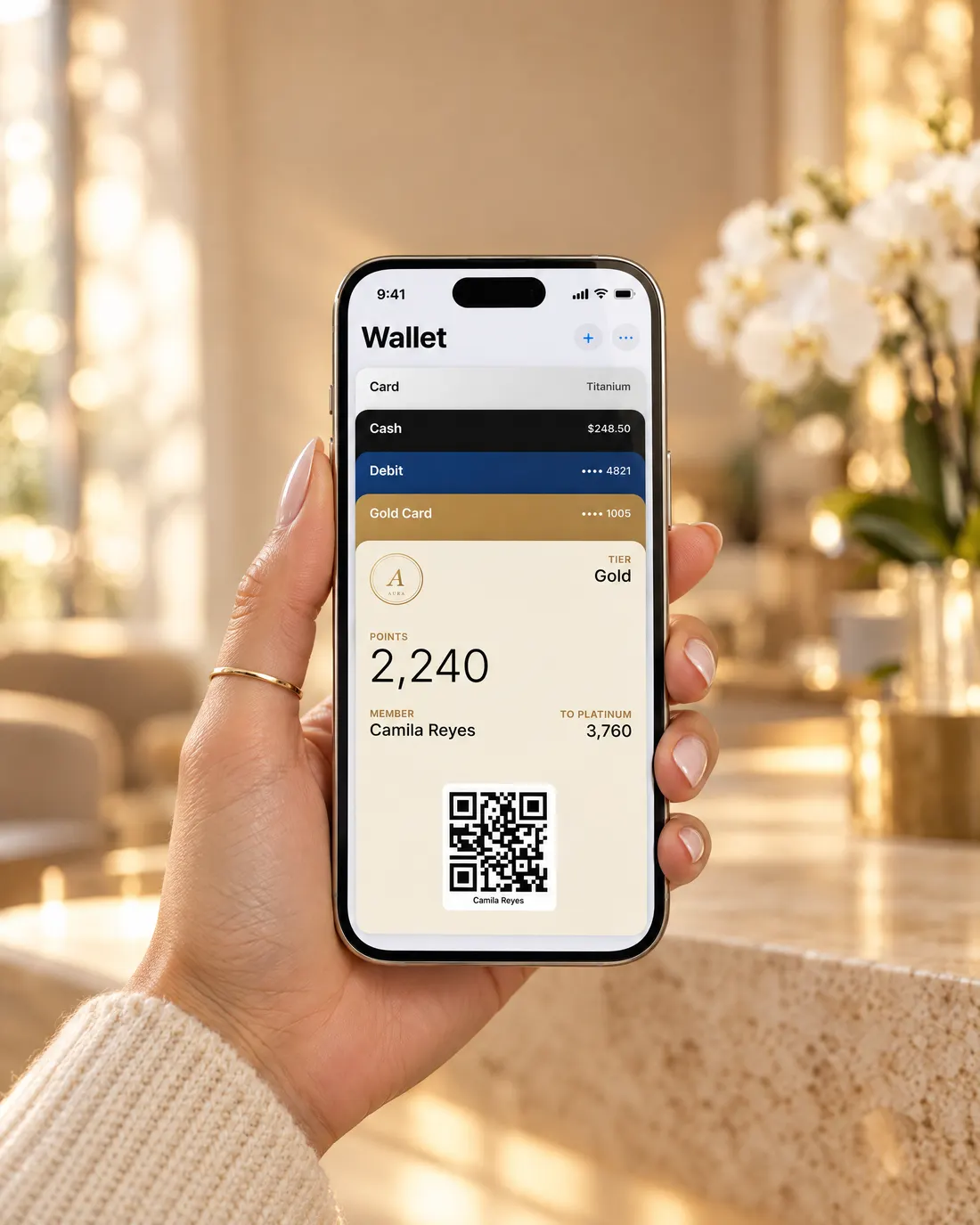A client holding an iPhone with a med spa's gold rewards card in Apple Wallet, showing 2,240 points and a QR code